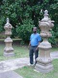 703 - Pair of Large Stone Garden Urns on stand with caps, 7ft. 4in.T, 2ft, W.