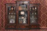 732 - Walnut Victorian 3 Door Bookcase with 3 drawers at bottom, burl trim, head carved in crown, 7ft. T, 72in. W, ca. 1860.