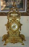 127 - Large Heavily carved French Mantle Clock with grotesque faces and griffins, porcelain face, ca. 1890.