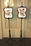 102 - Matched pair of rococo fire screens with porcelain inserts, 5 ft. T.