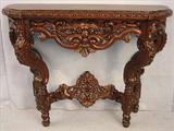 315 - Heavily Carved console Table with faces carved in legs, 34in. T, 44in. W, 18in. D.