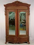 303 - Mahogany Heavily carved 2 door Wardrobe with claw feet, lions head on corners and carved crown, 98in. T, 57in. W, 23in. D, ca. 1890.