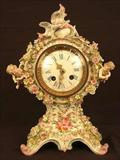 113 - Meissen Mantle Clock with cupids on each side and applied flowers, 13in. T 8in. W, 5in. D, ca. 1880.