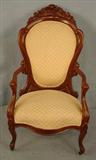 212 - Rosewood Rococo Arm Parlor Chair by J.H. Belter - rosalie without grapes, 42in. T, 23in. W, 21in. D, ca. 1855, beige upholstery.