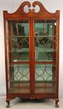 403 - Empire China Closet with arched top and fretwork on glass, 82in. T, 42in. W, 16in. D, ca. 1880.