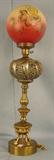 473 - Large Victorian Banquet Lamp with heavy metal work, red and yellow flowered round shade, 36in. T, 10in. Dia., electrified.