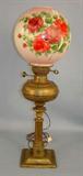 476 - Solid Brass Banquet Lamp with flowers on globe, originally gas, electrified, 30in. T, 9in. W.