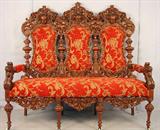 495 - Monumental Oak Heavily Carved Settee , grotesque faces, griffins on arms, outstanding with new upholstery, att. To R.J. Horner, ca. 1890, 60in. T, 60in. W, 26in. D.
