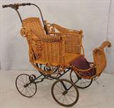 354 - Wicker Baby Buggy, 34in. T, 39in. W, ca. 1900.
