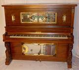 137 - Extreme Rare Lauter Orchestral Nickelodeon in a mahogany case with winged griffins, stained glass panel and lamps.