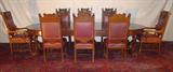 107 - Mahogany Dolphin Carved Dining Table, 60in. Round, opens to 12ft with 6 leaves by R.J. Horner.