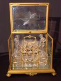 166 - 19th Century bronze and Etched Glass Tantalus Set, bottles have original stoppers.