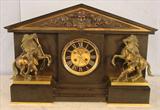 300 - Black Marble and Bronze French Mantle Clock with mounted bronze figures of slaves breaking horses on front and side, 15in. T, 21in. W, 8.5in. D, ca. 1880.