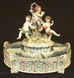 317 - Dresden Center Piece Ferner with 3 cupids and 4 flower sections, 14in. Dia. 11.5in. T, ca. 1880.