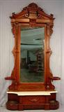 321a - Walnut Victorian Hall Tree with white marble and oval drip pans and griffin crest, stands 8ft 9in T, 55in. W, 16in. D, ca. 1870.