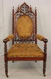 222 - Gothic Throne Chair, extensively caved, walnut with gold and bronze upholstery, probably N.Y., ca. 1870, 48in. T, 26in. W, 26in D.