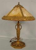 224 - Wonderful Panel Glass Lamp, heavy bronze base and shade, working condition, probably Miller, 22in. T, 16in. Dia.