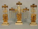 226 - Bronze and Crystal Prism 3 piece Girandole Set with cherub base and white marble, ca. 1870.