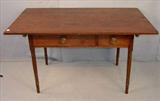 255 - Walnut Primitive Farm Table, 2 board top, tapered legs, 2 drawers with brass eagle hardware, ca. 1840, 56in. L, 36in. W, 31in. T.
