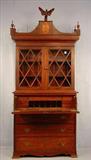 261 - Period Federal Secretary bookcase Desk, individual pained glass with wood carved eagle crest and finials, ogee bracket base, ca. 1830.