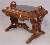 275 - Carved Walnut coffee Table, Cherubs holding a swan, carved wreath handles, original inset marble, 32in. W, 23in. D, 26in. T, ca. 1900.