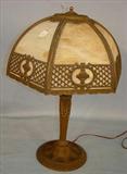 456 - Slag Glass Lamp with bronze base, bronze fretwork shade and amber glass, att. to Miller, 1910, 24in. X 15in.