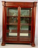 500 - Large Mahogany Empire China Cabinet, column front and mirrored back, 68in. T, 54in. W, 20in. D, ca. 1880.