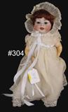 304 - 16in., Bisque Doll with jointed legs, composition body, sleepy eyes and open mouth, marked Made in Germany