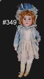 349 - 24in., Heinrich Handwerck, Bisque Head Doll with kid body, bisque forearm and hands, blue overcoat and bonnet