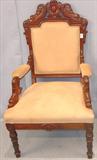149 - Mahogany Parlor Chair with cream upholstery and dolphins carved in crown