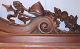 109 - 1911 Sideboard by Oriel Cabinet Co. that features massively carved mascarons, Norman soldiers, atlantes and caryatid figures as well as griffins in full relief (part of the "Norman Suite"), 95in. tall, 82in. wide, 28in. deep (crown, 2)