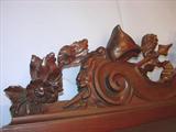 109 - 1911 Sideboard by Oriel Cabinet Co. that features massively carved mascarons, Norman soldiers, atlantes and caryatid figures as well as griffins in full relief (part of the "Norman Suite"), 95in. tall, 82in. wide, 28in. deep (crown)