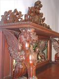 109 - 1911 Sideboard by Oriel Cabinet Co. that features massively carved mascarons, Norman soldiers, atlantes and caryatid figures as well as griffins in full relief (part of the "Norman Suite"), 99in. tall, 82in. wide, 28in. deep (griffins)