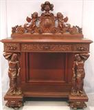 111 - 1911 Server by Oriel Cabinet Co. that features massively carved mascarons, Norman soldiers, atlantes and caryatid figures as well as griffins in full relief (part of the "Norman Suite"), 66in. tall, 54in. wide, 24in. deep