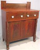 104 - Flamed Mahogany, Federal, Jackson Press with acanthus-carved pilasters, feather-carved feet and chimney back-splash, 59in. tall, 47in. wide, 22in. deep