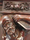 110 - 1911 China Cabinet by Oriel Cabinet Co. that features massively carved mascarons, Norman soldiers, atlantes and caryatid figures as well as griffins in full relief (part of the "Norman Suite"), 94in. tall, 66.5in. wide, 19in. deep (atlantes figure, 4)