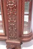 110 - 1911 China Cabinet by Oriel Cabinet Co. that features massively carved mascarons, Norman soldiers, atlantes and caryatid figures as well as griffins in full relief (part of the "Norman Suite"), 94in. tall, 66.5in. wide, 19in. deep (close-up)