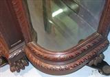 110 - 1911 China Cabinet by Oriel Cabinet Co. that features massively carved mascarons, Norman soldiers, atlantes and caryatid figures as well as griffins in full relief (part of the "Norman Suite"), 94in. tall, 66.5in. wide, 19in. deep (base)