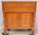 128 - Early, Solid Cherry, Jackson Press with three drawers and pineapple-carved pilasters, 50in. tall, 46in. wide, 22.5in. deep