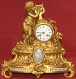 396 - Victorian, Gilt bronze Mantle Clock with cupid musician and Sevres plaques