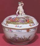 484 - 19th Century, Burlin scenic covered dish with cherub figurine top, 12in. wide, 15in. tall
