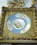 459 - 19th Century, Sevres plate in gilt frame with hand painting of lovers, 10in.