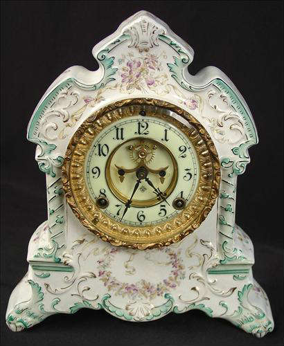 16 - Ansonia China Clock, Comanche, 12in. T, 11in. W, good running condition.