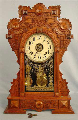 58 - Gilbert Forrest Clock, burl leaves, ca. 1891, 25in. T, 16in. W