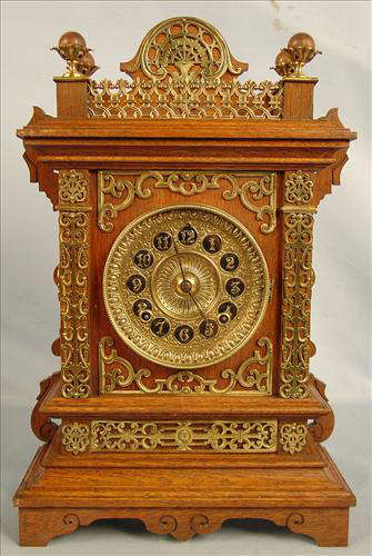 66 - Ansonia Oak Cabinet Clock with brass trim, 19in. T, 12in. W
