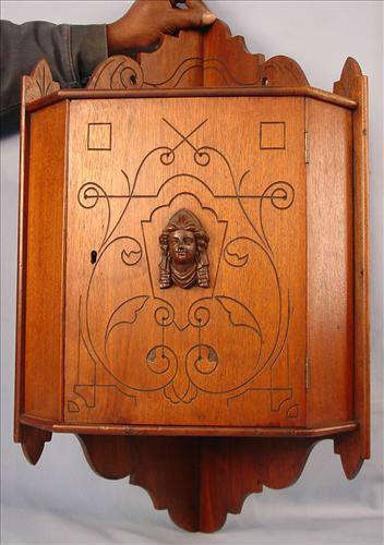 158 - Hanging Walnut Corner Cabinet, one door with ladies head, 29in. T, 16in. W, ca. 1875