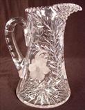 165 - Cut Glass Pitcher with handle and wheel cut flowers, daises, 10in. T, 8in. W