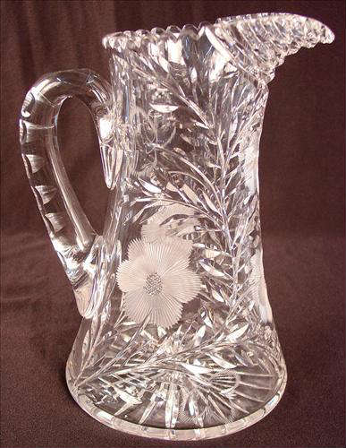 165 - Cut Glass Pitcher with handle and wheel cut flowers, daises, 10in. T, 8in. W