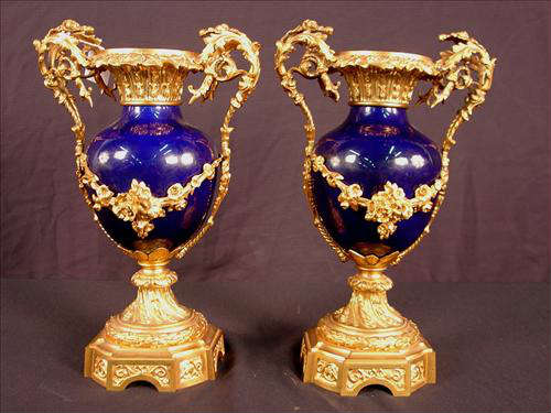 264 - Pair of Louis Phillipe Cobalt Blue Porcelain Urn form Vase, mounted on elaborate  dore bronze bases and bronze mounting, 16in. T.