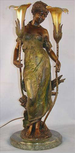 276 - Bronze Art Neveau Statue Lamp, signed Auguste Moreau, standing lady with iridescent shade on each side, green marble base, 29in. T, 11in. Dia. ca. 1915.